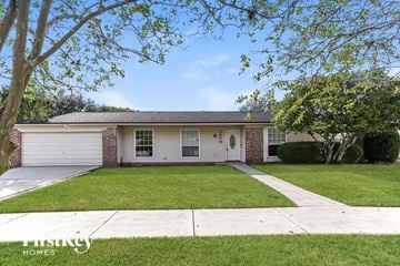 Jacksonville house for rent - a white and brick house with a lawn and trees