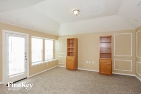 Euless house for rent - a bedroom with a closet and a window and a door