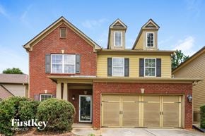 Atlanta house for rent - A two-story house with a garage is for sale.