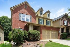 Atlanta house for rent - A two-story house with a garage is for sale.