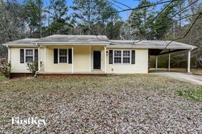 Conyers house for rent - A small house with a porch and a covered patio.