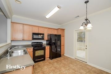 Chelsea house for rent - a kitchen with black appliances and wooden cabinets   and a door with a window