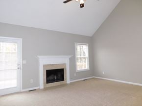 Powder Springs house for rent - a living room with a fireplace and a door