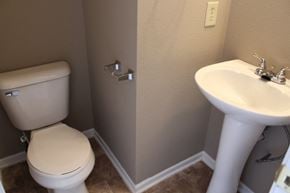Indianapolis house for rent - a small bathroom with a toilet and a sink