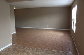 Indianapolis house for rent - an empty living room with a tiled floor