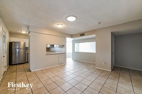 Phoenix house for rent - a kitchen with a stainless steel refrigerator and a sink