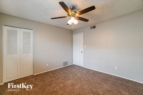 Phoenix house for rent - a bedroom with a ceiling fan and a closet