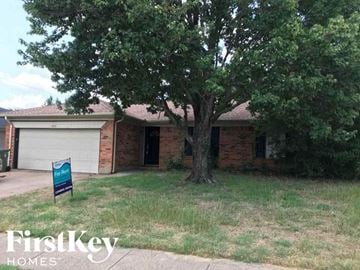 Arlington house for rent - a brick house with a tree in front of it