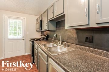 Indianapolis house for rent - A kitchen with a sink and a window.