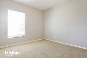 North Port house for rent - a bedroom with white walls and a window