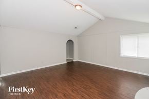Memphis house for rent - the living room with wood floors and white walls