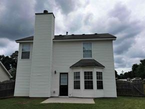 Douglasville house for rent - a white church building with a black door and a cloudy sky
