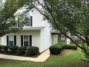 Douglasville house for rent - a white house with a sidewalk in front of it
