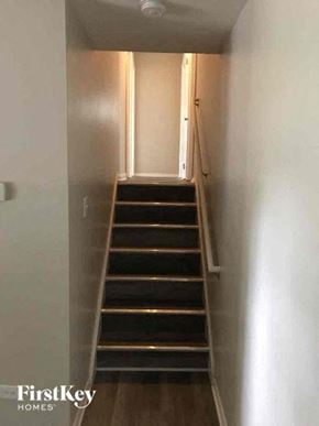 Richton Park house for rent - A staircase with a light on the side.