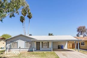 Phoenix house for rent - a white house with palm trees in front of it