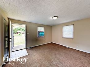 Indianapolis house for rent - A room with a carpet floor and a window.