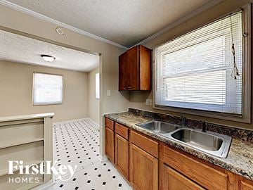 Indianapolis house for rent - A kitchen with a sink and a window.