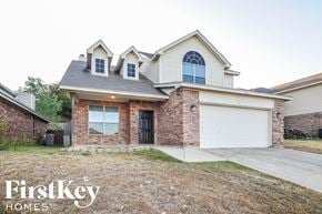 Fort Worth house for rent - a house with a driveway and a garage door