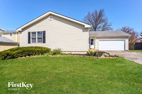 Florissant house for rent - a home with a lawn and a driveway