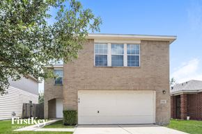 Houston house for rent - a brick house with a white garage door