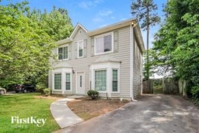 Acworth house for rent - a white house with green shutters and a driveway