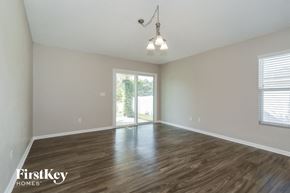 Middleburg house for rent - A room with wooden floors and a window with blinds.