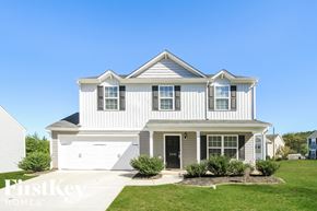 Winston-Salem house for rent - a white house with white siding and a lawn