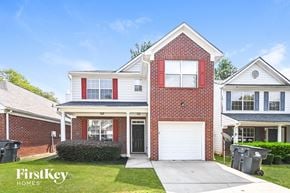 Union City house for rent - a brick house with a white garage door and a driveway