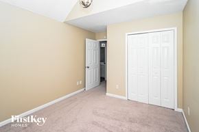 Union City house for rent - a bedroom with two closets and a carpeted floor