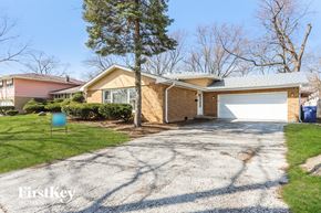 Matteson house for rent - A house with a driveway in front of it.