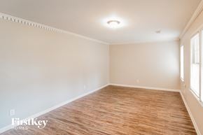 North Charleston house for rent - A room with wooden flooring and white walls.