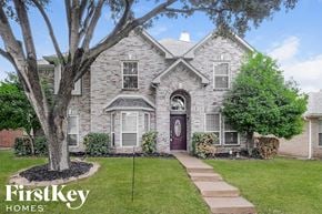 Mckinney house for rent - a brick house with a tree in front of it