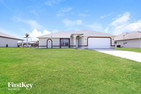 Cape Coral house for rent - a large lawn in front of a house
