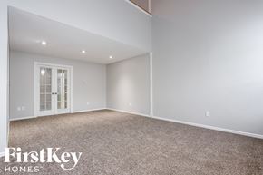 Indianapolis house for rent - the upstairs bonus room has carpet and a door to the balcony