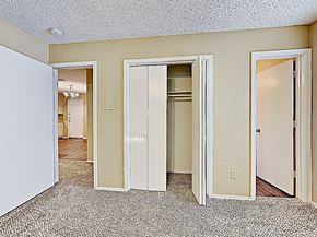 Fort Worth house for rent - the living room of an apartment with doors to the bedroom and the hallway