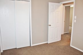 Brownsburg house for rent - a bedroom with a closet and a white door