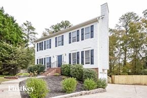 Acworth house for rent - the exterior of a white house with blue shutters