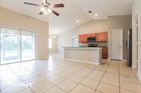 North Port house for rent - A spacious kitchen with a fan on the ceiling.
