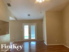 Rowlett house for rent - A room with a FirstKey Homes logo on the wall.