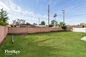 Glendale house for rent - the backyard of a house with a fence and grass