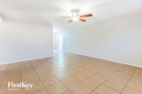 Phoenix house for rent - A spacious room with a ceiling fan and tiled floor.