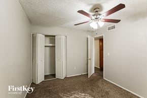 Glendale house for rent - a bedroom with a ceiling fan and a closet