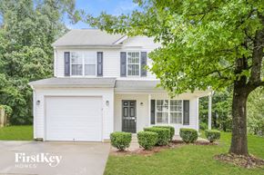 Greensboro house for rent - a white house with a tree in front of it