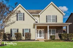 Cumming house for rent - A two-story house with a white door and windows.