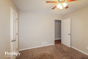 Sugar Hill house for rent - a bedroom with a ceiling fan and a door to a closet