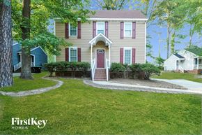 Knightdale house for rent - A house with a red door and a small porch.