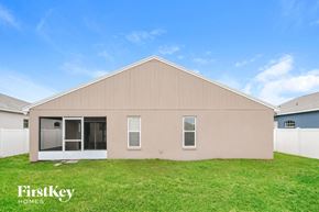 Winter Haven house for rent - the exterior of a house with a grassy yard