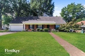 Memphis house for rent - A house with a lawn in front of it.
