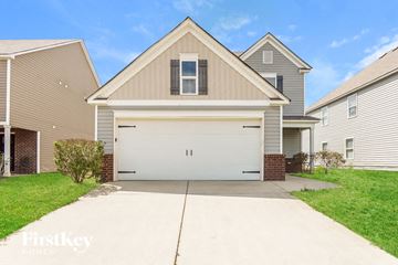 Bessemer house for rent - a white garage door in front of a house