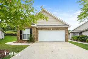 Bessemer house for rent - a white garage door in front of a brick house